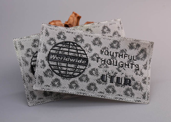 Stampato con le etichette su ordinazione del silicone del logos brillante nero per abbigliamento